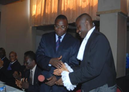 R - L: Chief Solo Akuma (SAN), being congratulated